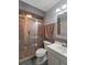 Bathroom featuring a walk-in shower with gold trim and a modern sink at 1039 Grand Concourse St, Charleston, SC 29412
