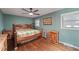 Bedroom with hardwood floors, natural light, and wooden furniture at 1039 Grand Concourse St, Charleston, SC 29412