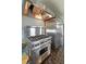 Gourmet kitchen featuring stainless steel range and refrigerator with dark tile flooring at 1039 Grand Concourse St, Charleston, SC 29412