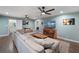 Spacious living room with comfortable sectional, hardwood floors, and views into the dining area at 1039 Grand Concourse St, Charleston, SC 29412
