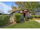 Charming outbuilding featuring wood and glass construction surrounded by lush landscaping at 1039 Grand Concourse St, Charleston, SC 29412