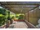Brick pathway through a pergola covered in greenery at 1039 Grand Concourse St, Charleston, SC 29412
