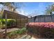 Brick patio surrounded by lush greenery and a wooden pergola offers an ideal outdoor space at 1039 Grand Concourse St, Charleston, SC 29412