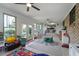 Bright sunroom featuring tile floors, lots of natural light, and a view of the backyard at 1039 Grand Concourse St, Charleston, SC 29412