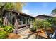 Exterior view of a sunroom addition with many windows and brick pavers at 1039 Grand Concourse St, Charleston, SC 29412