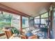 Bright sunroom with multiple seating areas and views of the outdoors at 1039 Grand Concourse St, Charleston, SC 29412