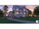 Elegant two-story home with a metal roof, private balconies, and a charming entrance staircase at 1077 Ship Builder St, Charleston, SC 29492