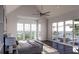 Light-filled main bedroom with views of the pool and surrounding landscape from multiple windows at 1077 Ship Builder St, Charleston, SC 29492