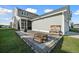 Back patio area with paver stones, wood benches, and grill at 108 Arrowwood Way, Summerville, SC 29485