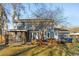 Exterior of home featuring a screened-in porch, backyard deck, mature trees, and fenced yard at 115 Laurel Ridge Rd, North Charleston, SC 29418