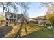Large backyard featuring mature trees, an outdoor deck, a screened-in porch, and room to play at 115 Laurel Ridge Rd, North Charleston, SC 29418