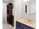 Modern bathroom showcasing dark cabinets, light countertops, and a round mirror at 115 Laurel Ridge Rd, North Charleston, SC 29418