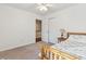 Cozy bedroom featuring light carpet, ceiling fan, and a closet near the doorway at 115 Laurel Ridge Rd, North Charleston, SC 29418