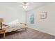 Bright bedroom with light carpet, ceiling fan, and a sunny window with blinds at 115 Laurel Ridge Rd, North Charleston, SC 29418