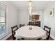 Warm dining room features an elegant chandelier and plenty of natural light from a window at 115 Laurel Ridge Rd, North Charleston, SC 29418