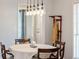 This dining room has natural lighting, chandelier lighting, and a view into the entryway at 115 Laurel Ridge Rd, North Charleston, SC 29418