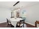 This dining room has natural lighting, chandelier lighting, and a view into the entryway at 115 Laurel Ridge Rd, North Charleston, SC 29418