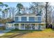 Beautiful two-story home with a classic front porch and a spacious yard at 115 Laurel Ridge Rd, North Charleston, SC 29418