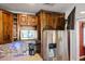 Stainless steel refrigerator and microwave are complimented by beautiful wooden cabinetry at 115 Laurel Ridge Rd, North Charleston, SC 29418