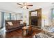Comfortable living room with a brick fireplace, hardwood floors, and natural light at 115 Laurel Ridge Rd, North Charleston, SC 29418