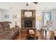 Living room featuring hardwood floors, a brick fireplace, and stylish furniture at 115 Laurel Ridge Rd, North Charleston, SC 29418