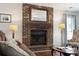 Living room features a brick fireplace, sofa and side chairs at 115 Laurel Ridge Rd, North Charleston, SC 29418