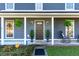 Inviting porch with rocking chairs, potted plants, and a charming entrance at 115 Laurel Ridge Rd, North Charleston, SC 29418