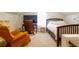 Comfortable bedroom featuring an office space, plush carpeting, a wooden bed frame and an arm chair at 117 Loblolly Ln, Summerville, SC 29483