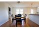 Eat-in kitchen with a breakfast bar, modern lighting, and access to the laundry room at 117 Loblolly Ln, Summerville, SC 29483