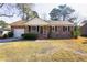 Charming brick home with manicured lawn and attached garage, creating instant curb appeal at 117 Loblolly Ln, Summerville, SC 29483