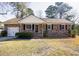 Charming single-story brick home with a manicured front yard and an attached garage at 117 Loblolly Ln, Summerville, SC 29483