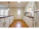 Bright kitchen with white cabinets, wooden countertops, and stainless-steel appliances at 117 Loblolly Ln, Summerville, SC 29483
