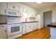 Bright kitchen with white cabinets, wooden countertops, and stainless-steel appliances at 117 Loblolly Ln, Summerville, SC 29483