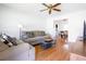 Bright living room features hardwood floors, a ceiling fan, and neutral-toned furniture at 117 Loblolly Ln, Summerville, SC 29483