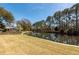 Enjoy this large backyard, views of a pond and trees at 1233 Bridgeport Dr, Mount Pleasant, SC 29466