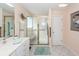 Bright bathroom with a tiled floor, glass shower, vanity, and a framed painting at 1233 Bridgeport Dr, Mount Pleasant, SC 29466