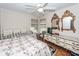 Bedroom features multiple mirrors, ceiling fan and dresser with drawers at 1233 Bridgeport Dr, Mount Pleasant, SC 29466