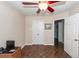 Bedroom featuring a closet, wood floors, a ceiling fan and multiple doors at 1233 Bridgeport Dr, Mount Pleasant, SC 29466