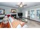 Cozy living room featuring a fireplace, ceiling fan, and french doors to a patio or deck at 1233 Bridgeport Dr, Mount Pleasant, SC 29466