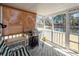 Enclosed porch featuring a grill and view of backyard and waterfront at 1233 Bridgeport Dr, Mount Pleasant, SC 29466