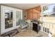 Enclosed porch features a grill, tile floor and view of the back yard at 1233 Bridgeport Dr, Mount Pleasant, SC 29466