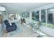Bright sunroom with lots of windows for water view, tiled floors, and cozy seating at 1233 Bridgeport Dr, Mount Pleasant, SC 29466