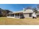 The back of the home features a spacious sunroom, ideal for enjoying the serene backyard at 1233 Bridgeport Dr, Mount Pleasant, SC 29466