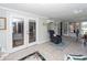 Relaxing sunroom with tiled floor, bright windows and doors to other rooms at 1233 Bridgeport Dr, Mount Pleasant, SC 29466