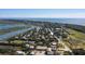 Stunning aerial view showcasing the property's prime location amidst lush trees, close to the water and local landmarks at 1302 Middle St, Sullivans Island, SC 29482