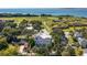 Expansive aerial view showing the home's proximity to green spaces, waterfront, and a historic fort at 1302 Middle St, Sullivans Island, SC 29482