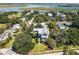 Stunning aerial view of a beautifully landscaped home nestled among lush greenery, showcasing its prime location at 1302 Middle St, Sullivans Island, SC 29482