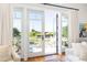 Expansive balcony with seating and views of historic fort at 1302 Middle St, Sullivans Island, SC 29482