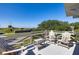 Relaxing balcony with wooden chairs and a peaceful view of the fort at 1302 Middle St, Sullivans Island, SC 29482