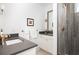Well-lit bathroom with a sleek vanity, modern fixtures, and a glass-enclosed shower at 1302 Middle St, Sullivans Island, SC 29482